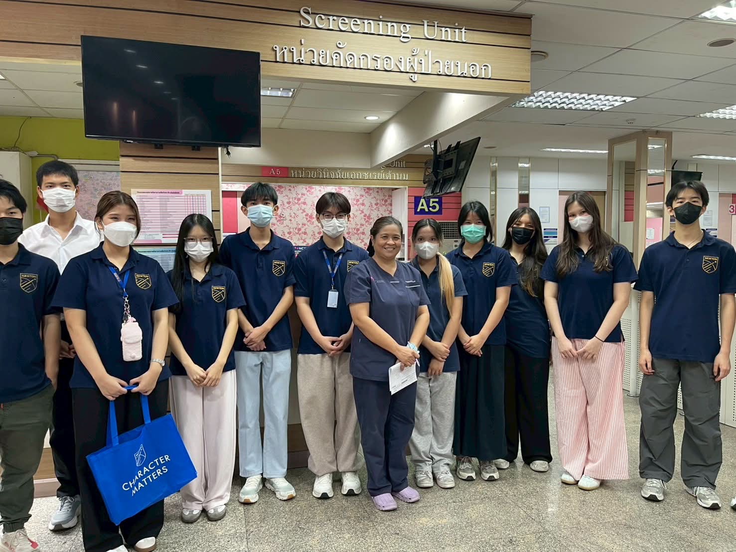 Newton students during the 2nd volunteering trip at the hospital screening unit
